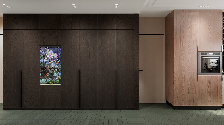 фото:Связующим звеном между кухней-гостиной и прихожей является коридор. Платяной шкаф расположен вдоль всего коридора и выполнен в темных тонах, чтоб оттенить цвета в интерьере. Фасады гладкие и не навязчивые. Главным акцентов выступает прекрасный аквариум. Такое размещение аквариума позволяет скрыть все необходимые для него коммуникации и скрыть истинные габариты аквариума