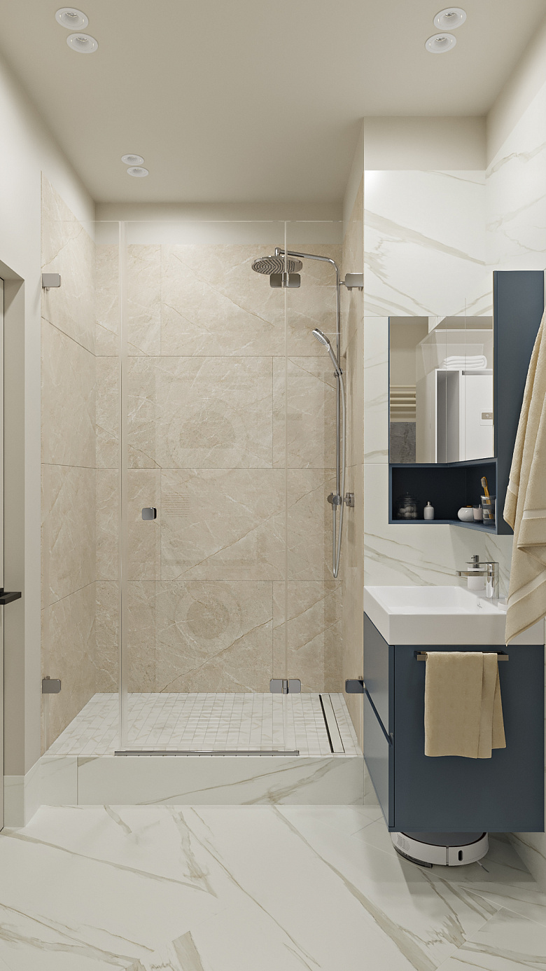 Просторную душевую удалось разместить в постирочной комнате. Подиум выполнили в строительном исполнении с трапом, уложив мозаику для более безопасного использования. Также организовали стеклянную перегородку с распашной дверцей фото:Просторную душевую удалось разместить в постирочной комнате. Подиум выполнили в строительном исполнении с трапом, уложив мозаику для более безопасного использования. Также организовали стеклянную перегородку с распашной дверцей