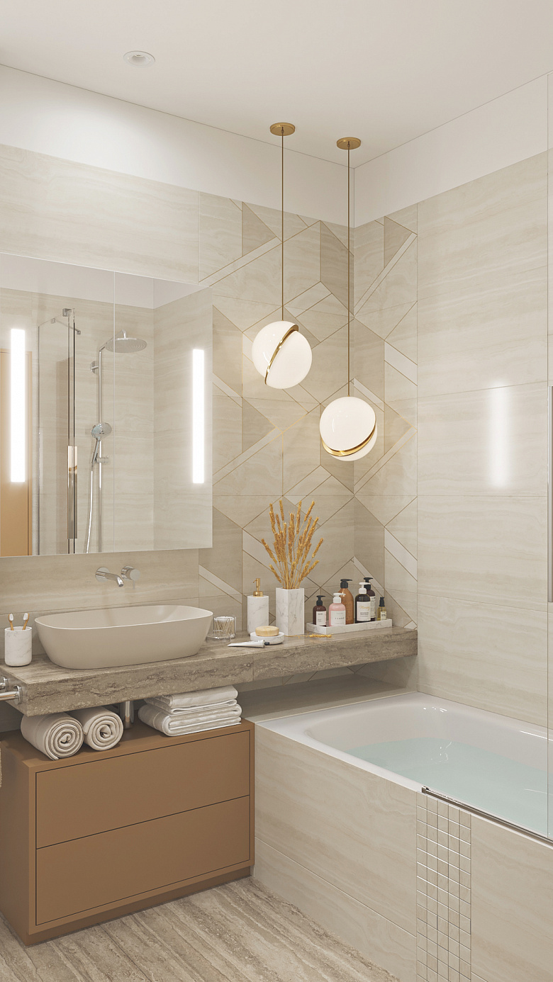 При входе в ванную комнату можно увидеть два изящных световых подвеса, которые подсвечивают необычный керамогранит с декором. В декоре используется специальная золотая краска, которая прекрасно играет в лучах света. Ниже на широкой столешнице красиво расположен декор и любимые косметические средства фото:При входе в ванную комнату можно увидеть два изящных световых подвеса, которые подсвечивают необычный керамогранит с декором. В декоре используется специальная золотая краска, которая прекрасно играет в лучах света. Ниже на широкой столешнице красиво расположен декор и любимые косметические средства