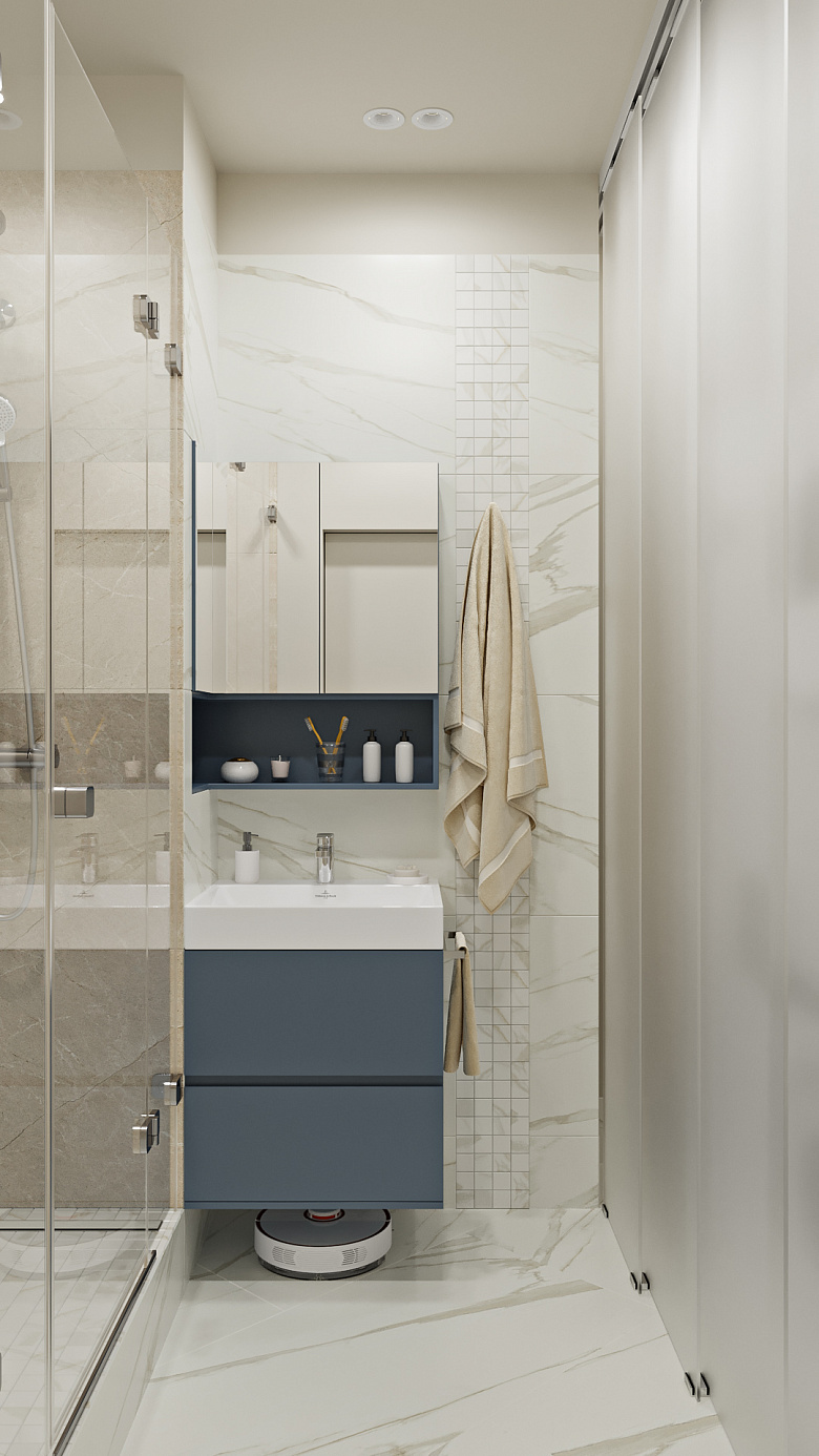 При входе в это помещение мы видим функциональную зону раковины в акцептном серо-синем оттенке. Тумба с зеркалом продумана с удобным хранением и возможностью зарядки робота пылесоса фото:При входе в это помещение мы видим функциональную зону раковины в акцептном серо-синем оттенке. Тумба с зеркалом продумана с удобным хранением и возможностью зарядки робота пылесоса